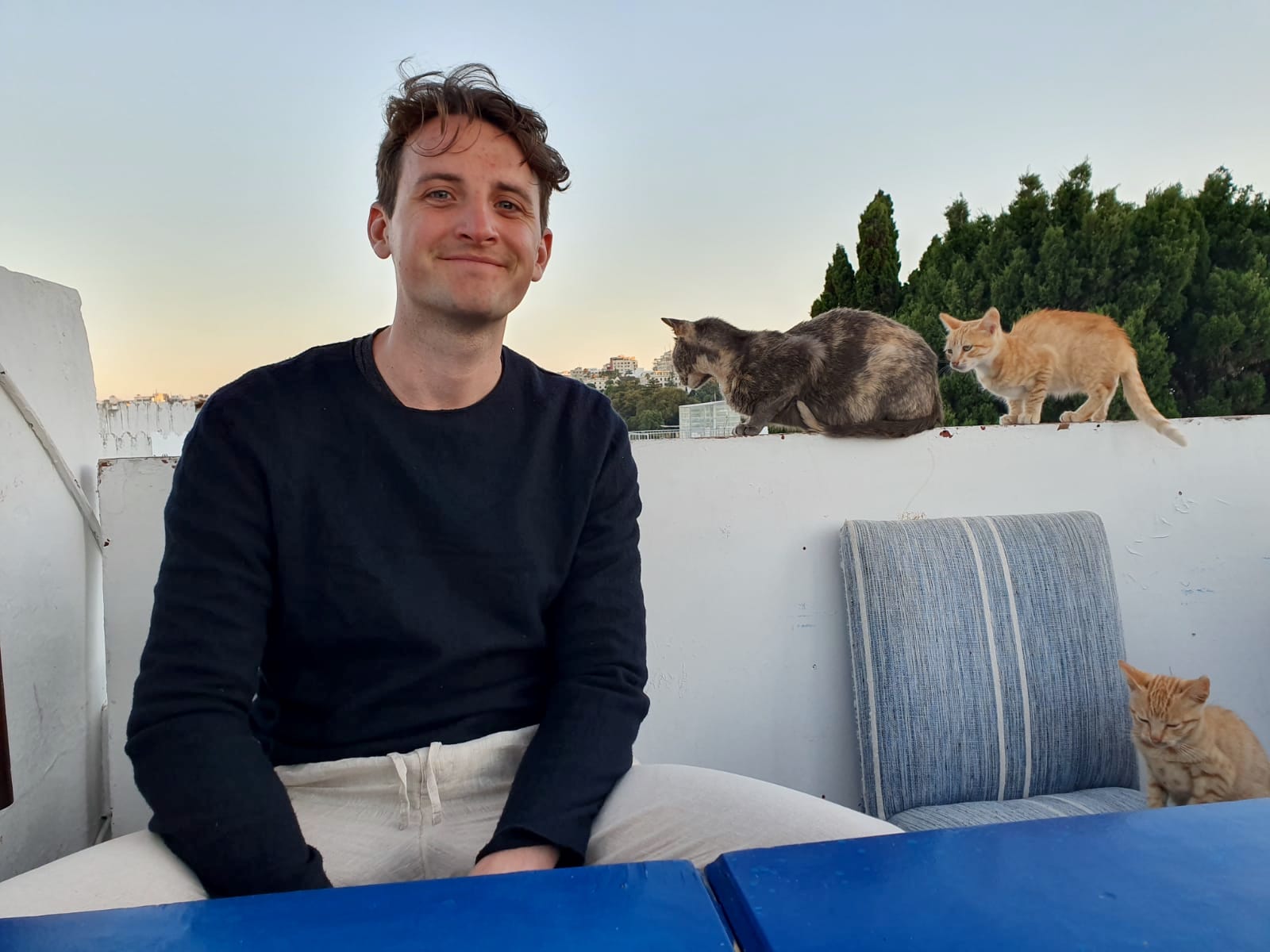 Image of Robbie Singer and some cats