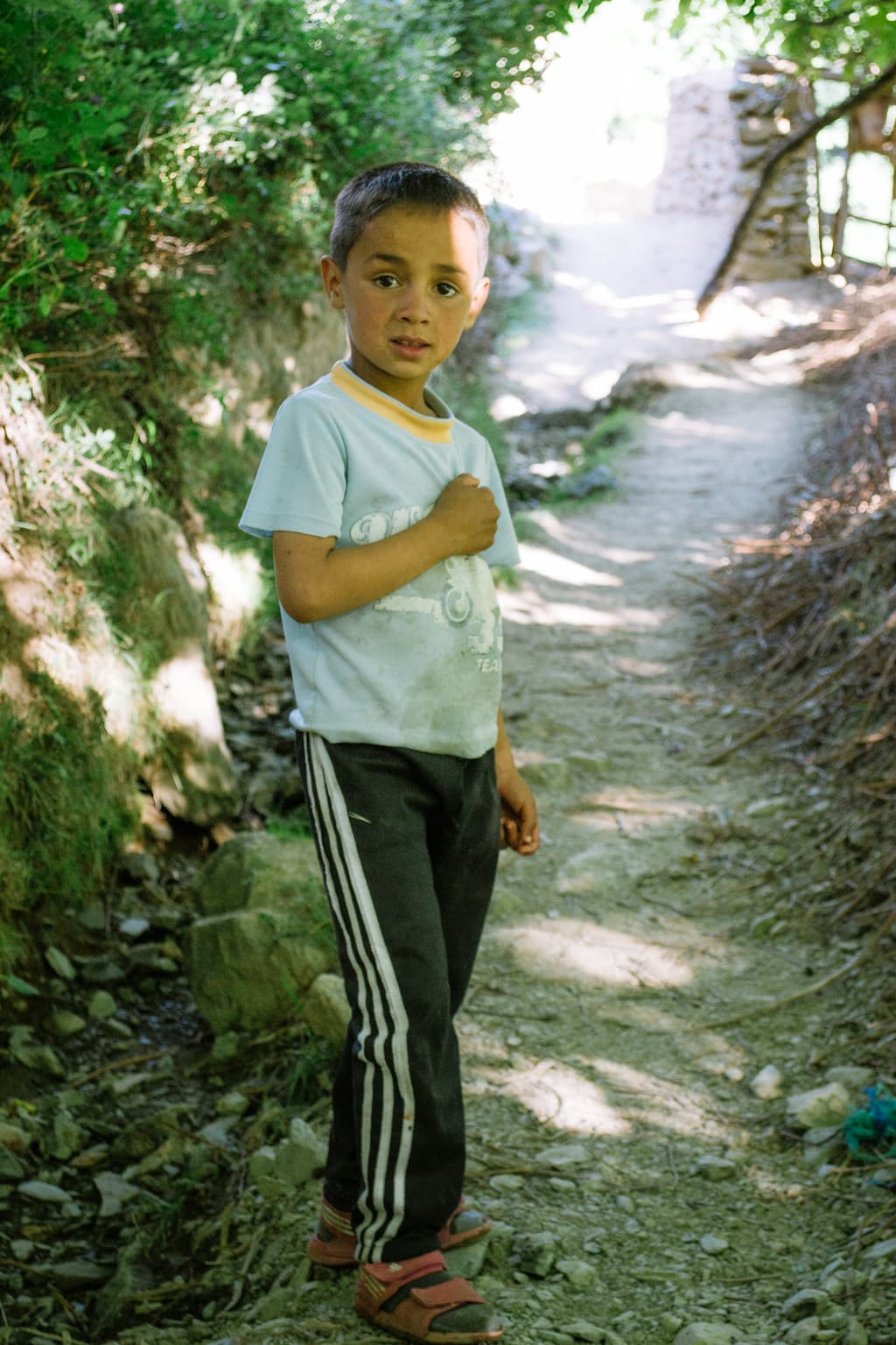 A young moroccan boy on a dusty path