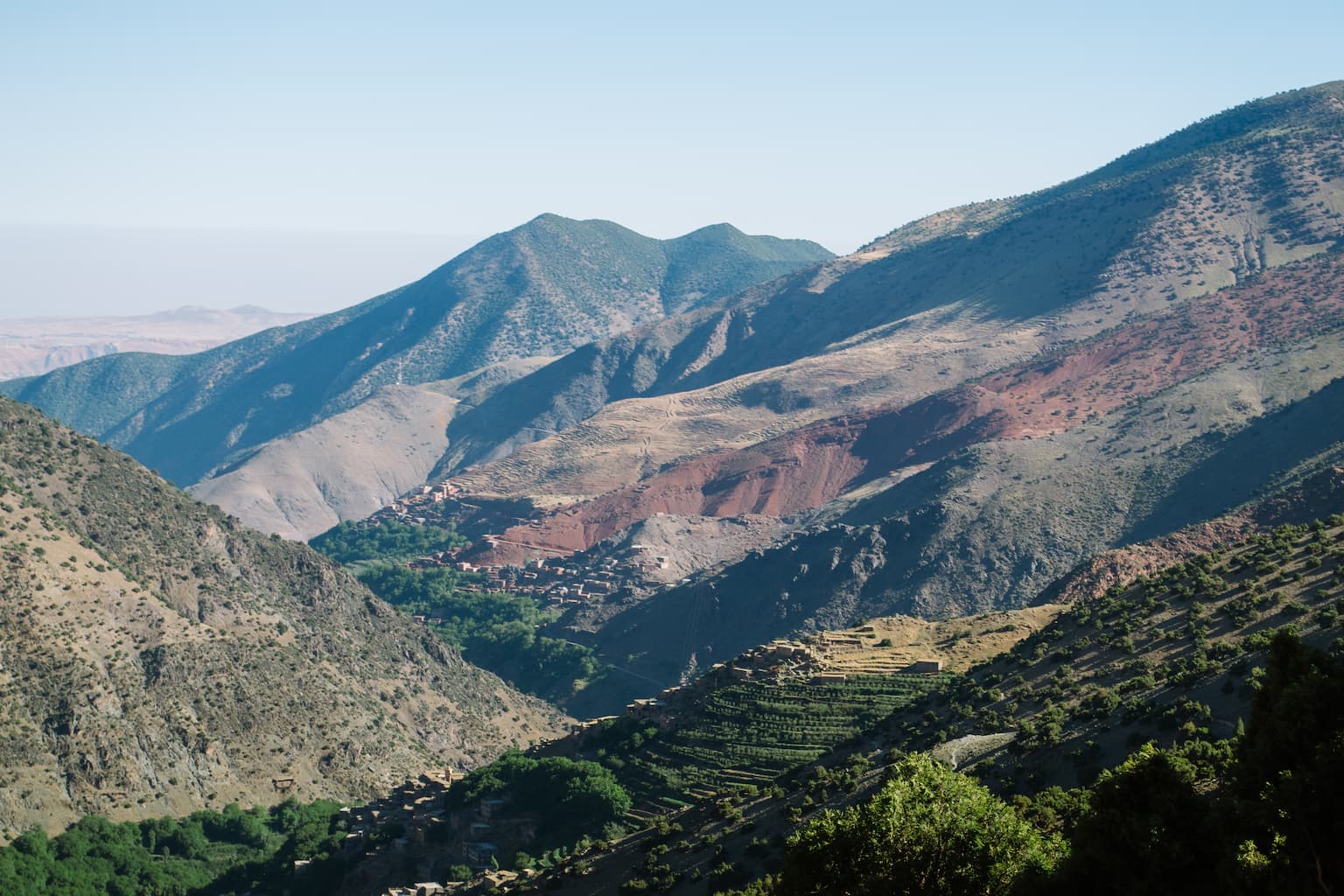 Different coloured layers of the Atlas mountains. Green, beige and red