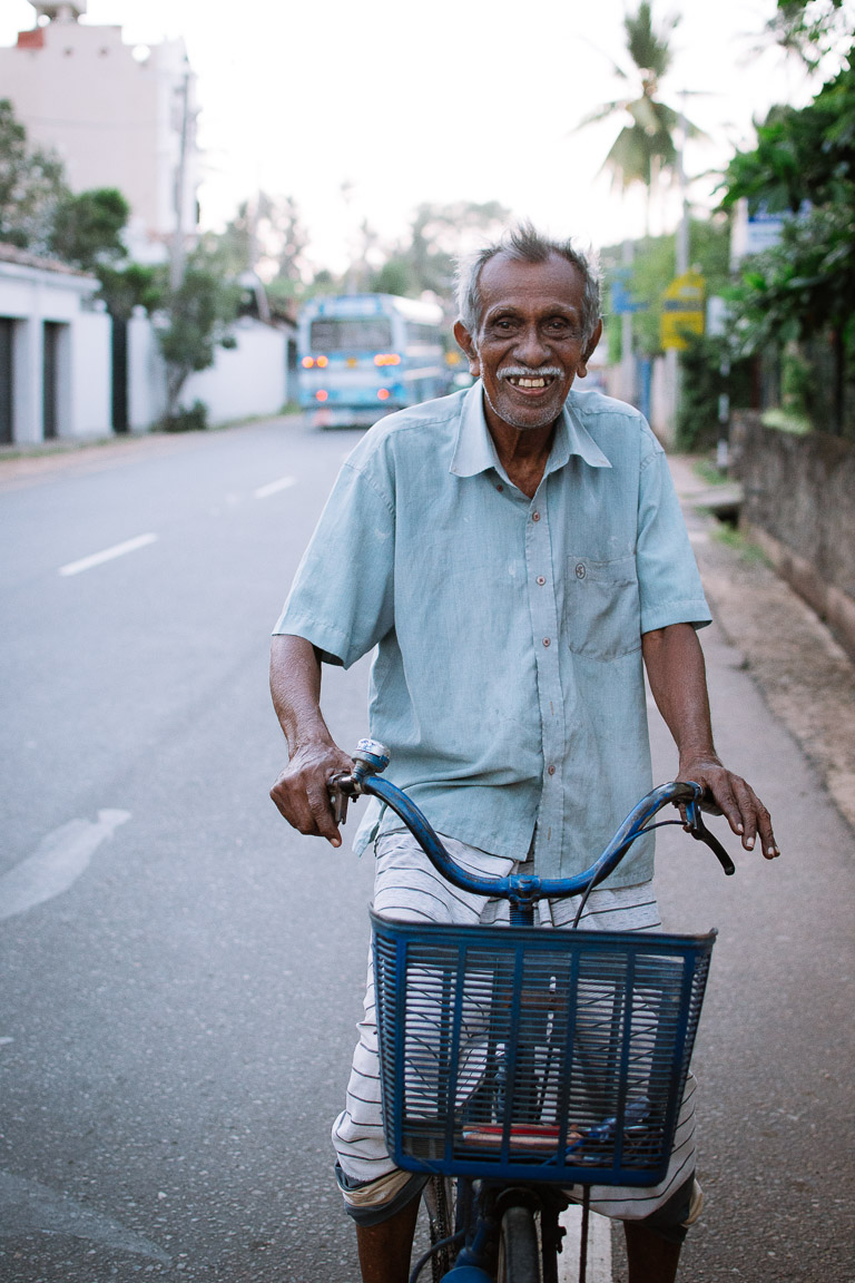 A Sri lankan man on a bike