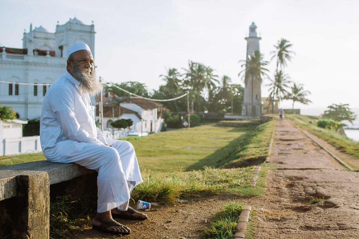 A Sri lankan man on the wall of Galle fort