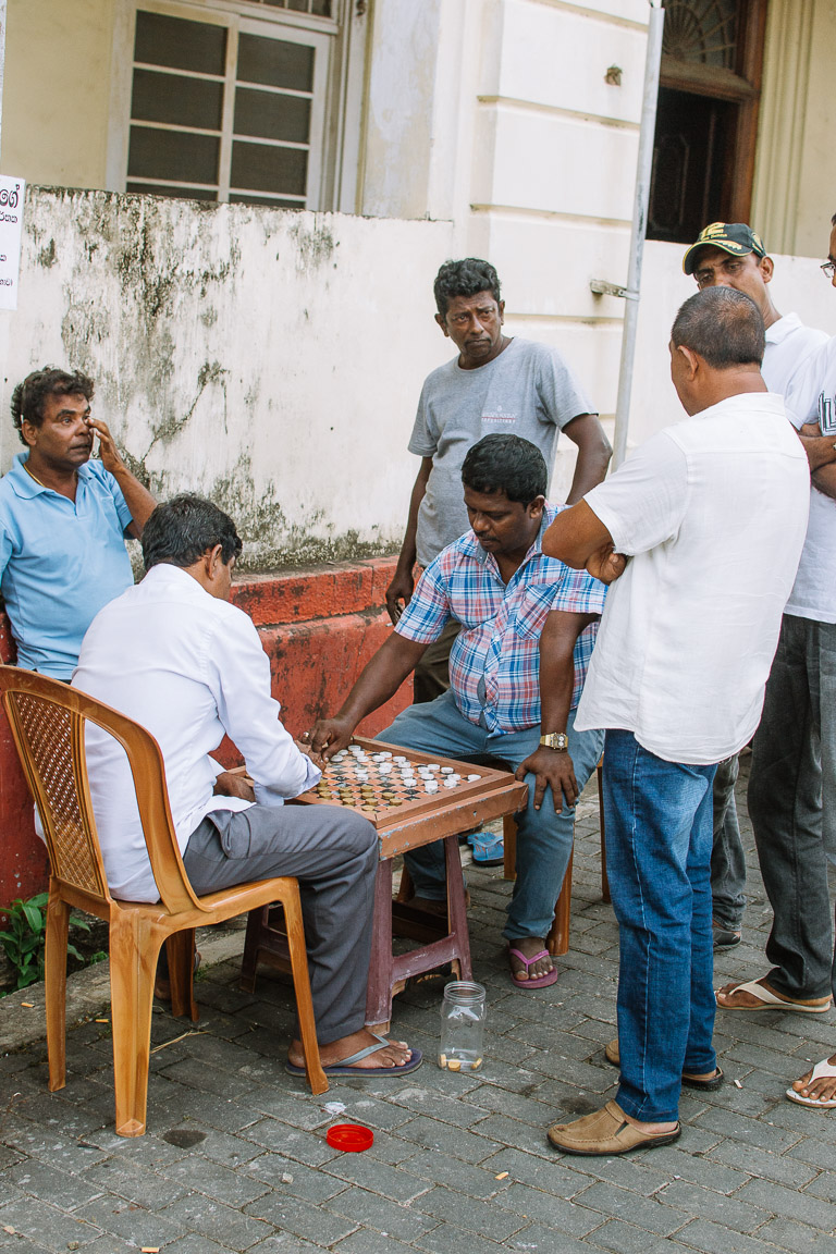 Sri lankan men playing checkers